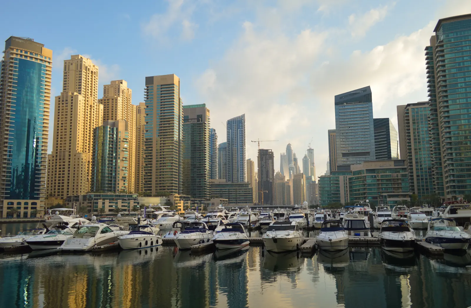 Yachts in Dubai Marina with the marina towers behind